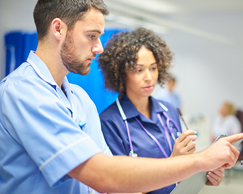 two nurses discussing - post-graduate nursing program