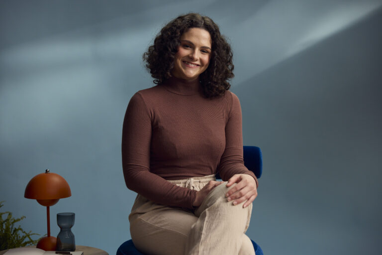 Student Mentor Chloe Greenwood sitting on a chair